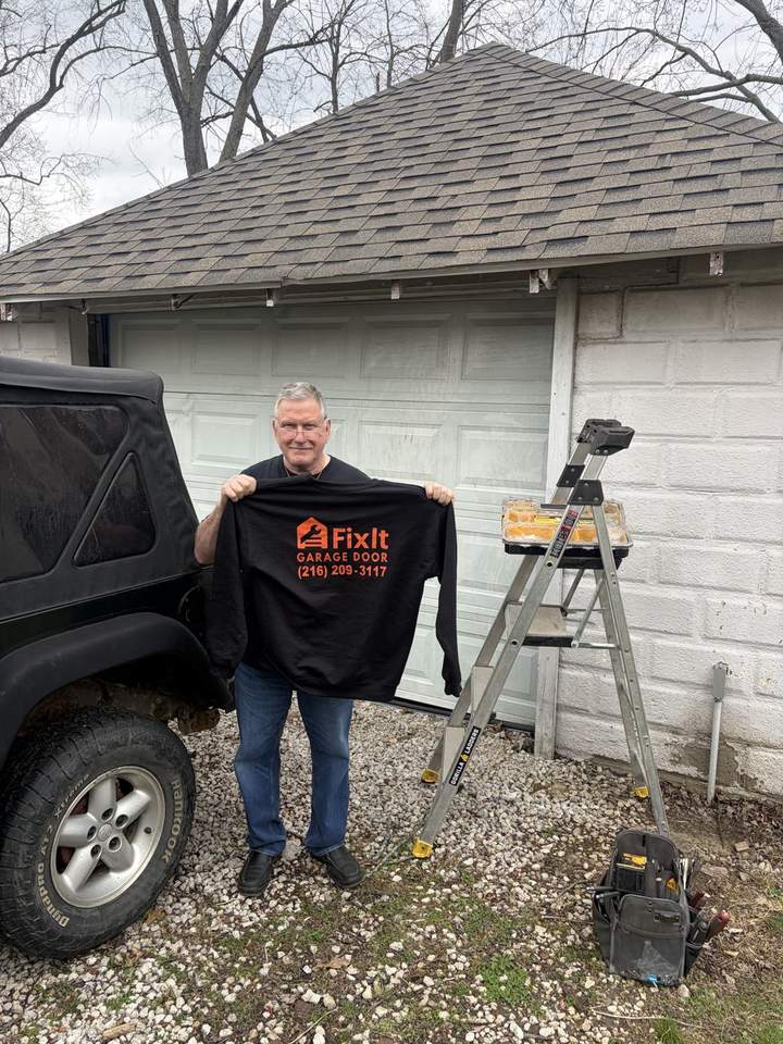 FixIt team member on site with garage door service equipment